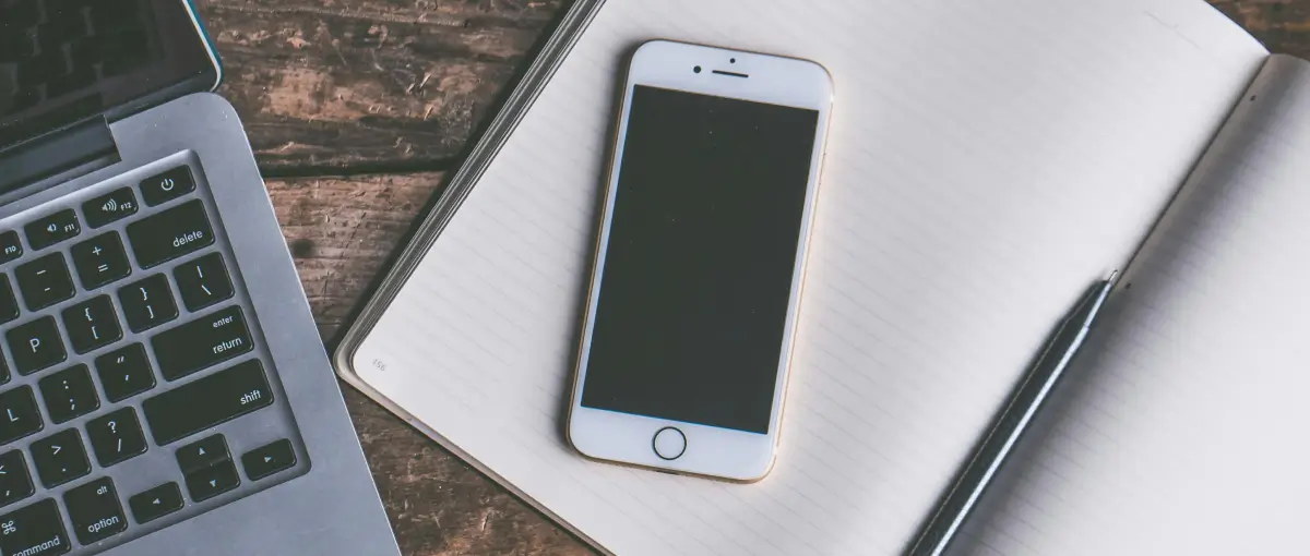 iphone in recovery mode laying on desk