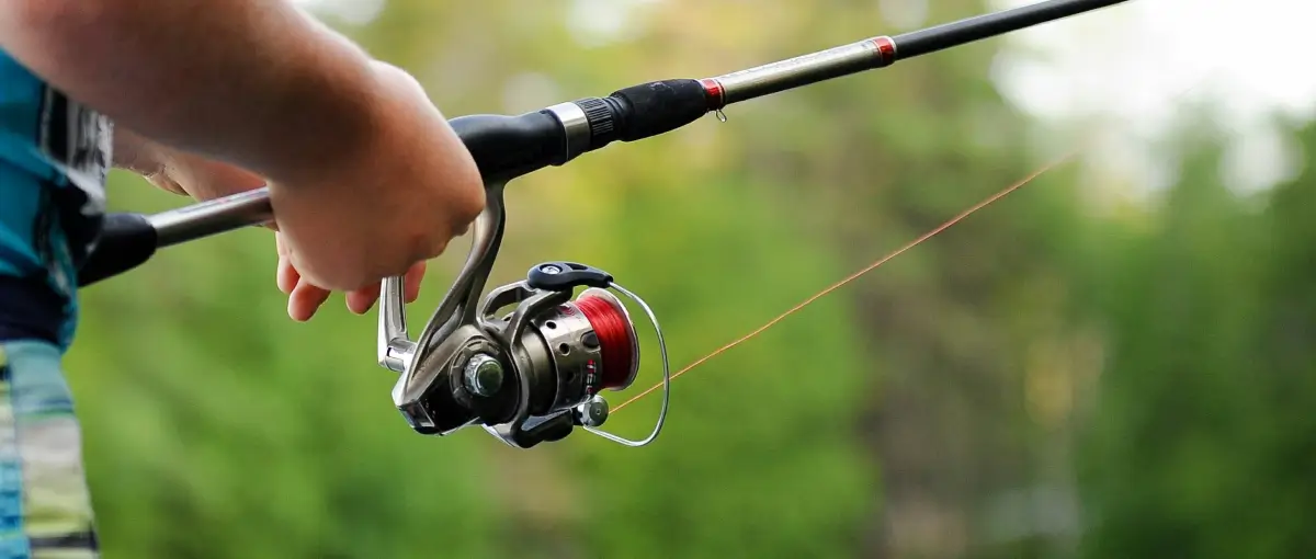 man fishing using GoPro camera to record