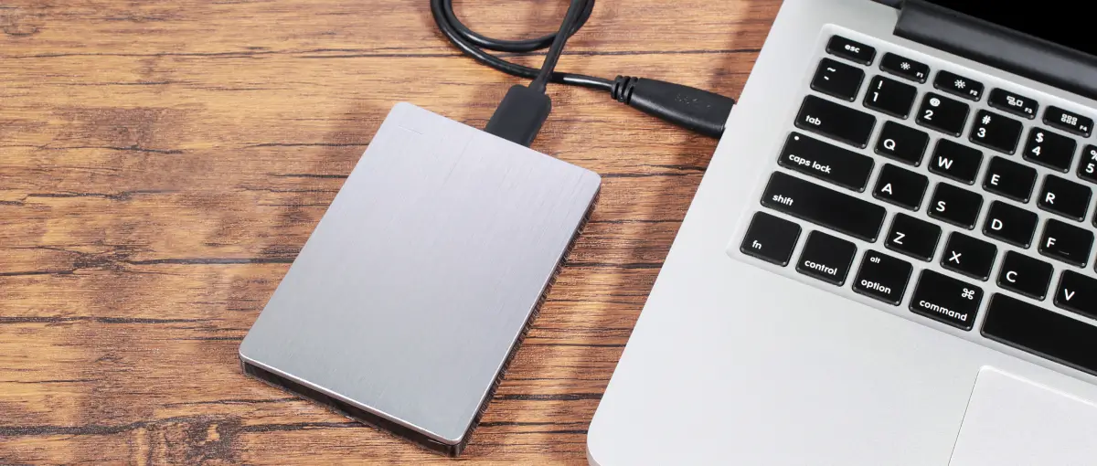 An external hard drive formatted for exFAT plugged into a MacBook.