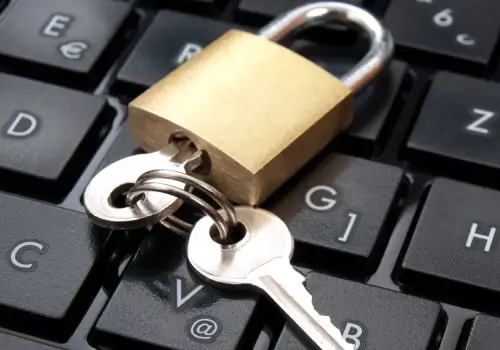 A lock on a keyboard represents the encryption process to protect stored data.