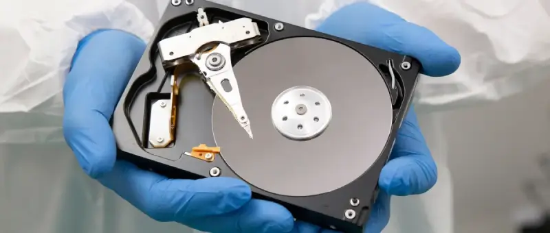 An image of a data recovery engineer showing the inside of a hard drive.