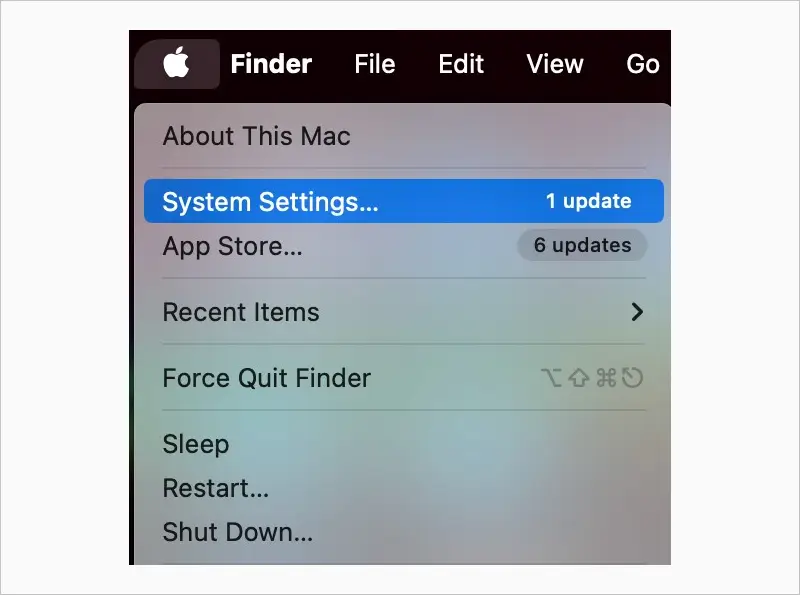 A screenshot showing the System Settings option within the Apple menu on macOS.