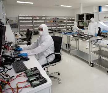 Data recovery engineers work inside a certified cleanroom to restore data on multiple hard drives.