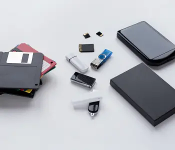A collection of popular storage devices, including hard drives, USB sticks, media cards, and floppy disks.