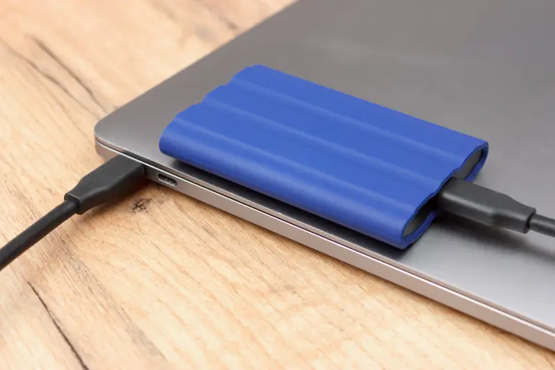 An external solid-state drive formatted for exFAT plugged into a Mac.