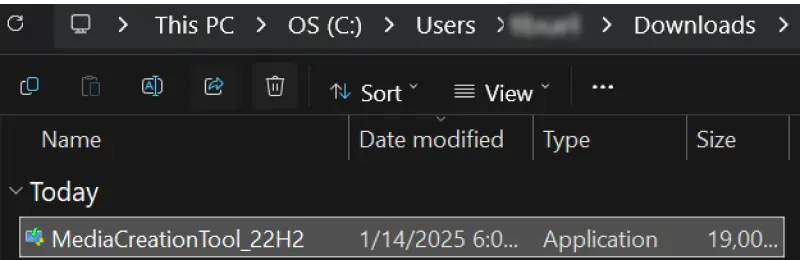 A screenshot showing the location of the Media Creation Tool in the Downloads folder.